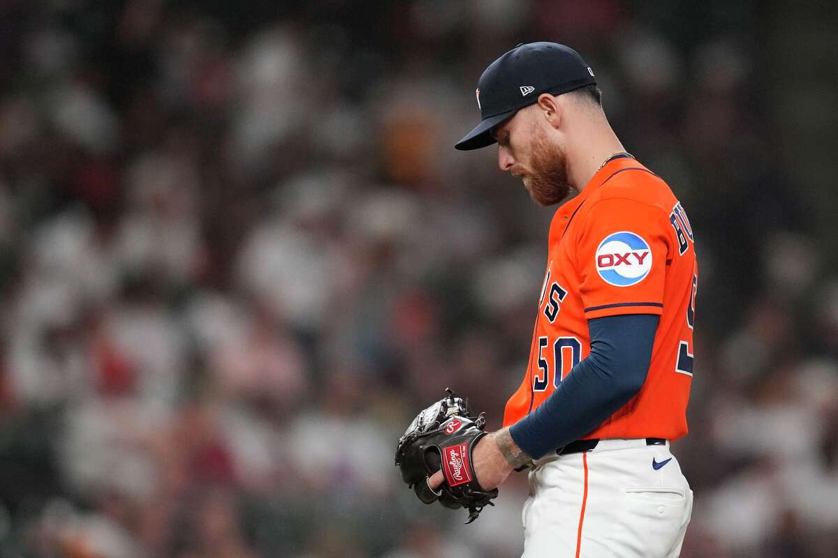 Houston Astros starting pitcher Mike Burrows (50) reacts after giving up a two-run home run to Los Angeles Angels Josh Lowe during the second inning of a MLB baseball game at Daikin Park, Friday, March 27, 2026, in Houston.