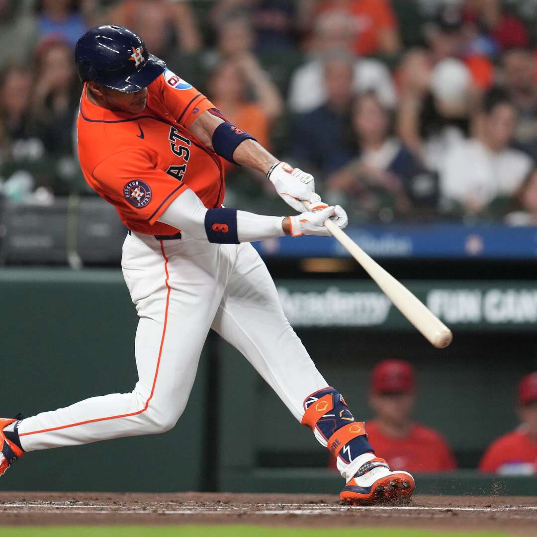 Houston Astros Jeremy Peña (3) hits a single during the first inning of a MLB baseball game at Daikin Park, Friday, March 27, 2026, in Houston.