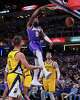 Los Angeles Lakers guard Bronny James (9) gets a dunk against the Indiana Pacers during the second half of an NBA basketball game in Indianapolis, Wednesday, March 25, 2026.