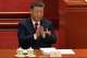 Chinese President Xi Jinping applauds during the closing session of the National People's Congress (NPC) at the Great Hall of the People in Beijing, Thursday, March 12, 2026.