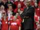 Illinois-Chicago's head coach Jimmy Collins watches the game from the bench in the second half of a college basketball game against Wisconsin on Dec. 27, 2009, in Madison, Wisconsin.