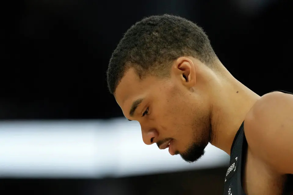 San Antonio Spurs' Victor Wembanyama looks on during the first half of an NBA basketball game against the Milwaukee Bucks, Saturday, March 28, 2026, in Milwaukee.