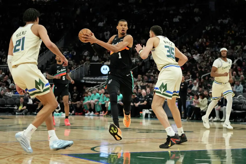 San Antonio Spurs' Victor Wembanyama (1) drives to the basket against Milwaukee Bucks' Pete Nance during the second half of an NBA basketball game Saturday, March 28, 2026, in Milwaukee. (AP Photo/Aaron Gash)