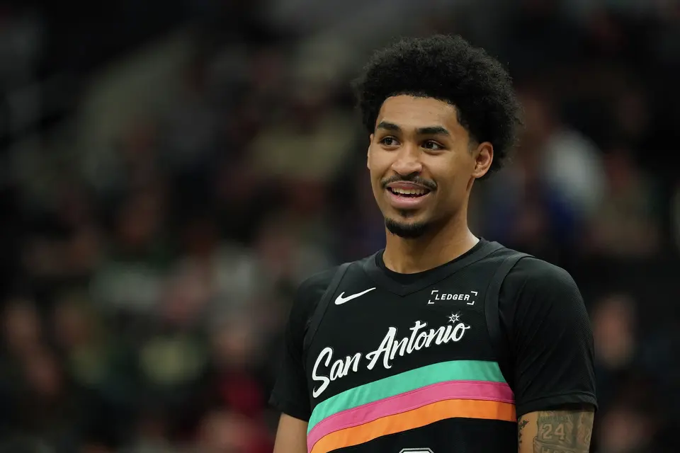 San Antonio Spurs' Dylan Harper smiles during the second half of an NBA basketball game against the Milwaukee Bucks, Saturday, March 28, 2026, in Milwaukee. (AP Photo/Aaron Gash)
