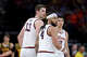 Kylan Boswell #4 and Tomislav Ivisic #13 of the Illinois Fighting Illini react against the Iowa Hawkeyes during the first half in the Elite Eight of the 2026 NCAA Men's Basketball Tournament at Toyota Center on March 28, 2026, in Houston, Texas.