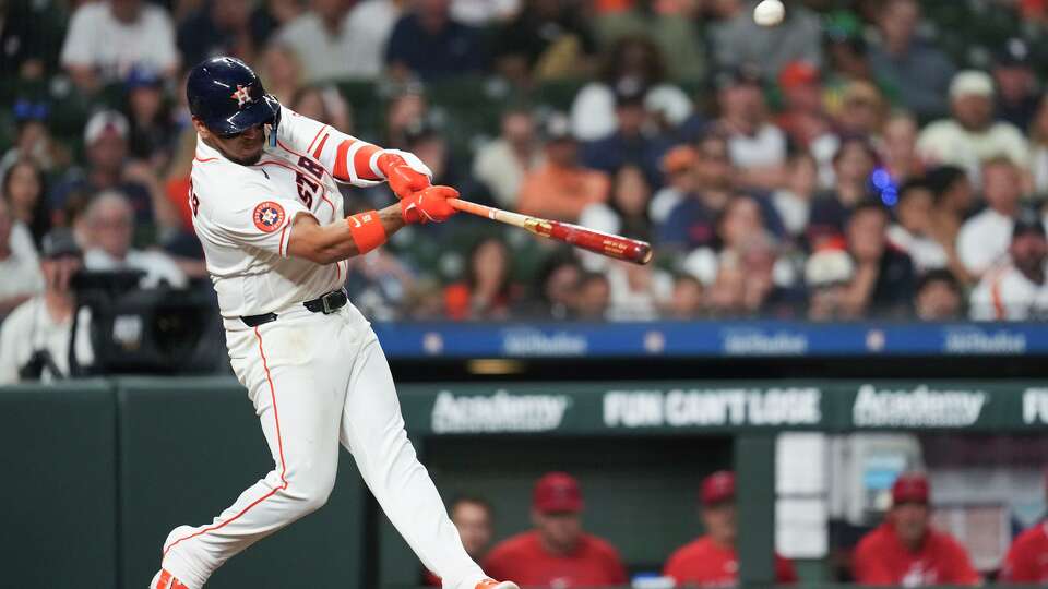 Houston Astros Isaac Paredes (15) hits a double during the fifth inning of a MLB baseball game at Daikin Park, Saturday, March 28, 2026, in Houston.