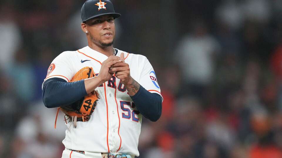 Houston Astros pitcher Bryan Abreu reacts as catcher Yainer Diaz comes to talk with him after giving up a 3-run home run to Los Angeles Angels Nolan Schanuel during the ninth inning of a MLB baseball game at Daikin Park, Saturday, March 28, 2026, in Houston.