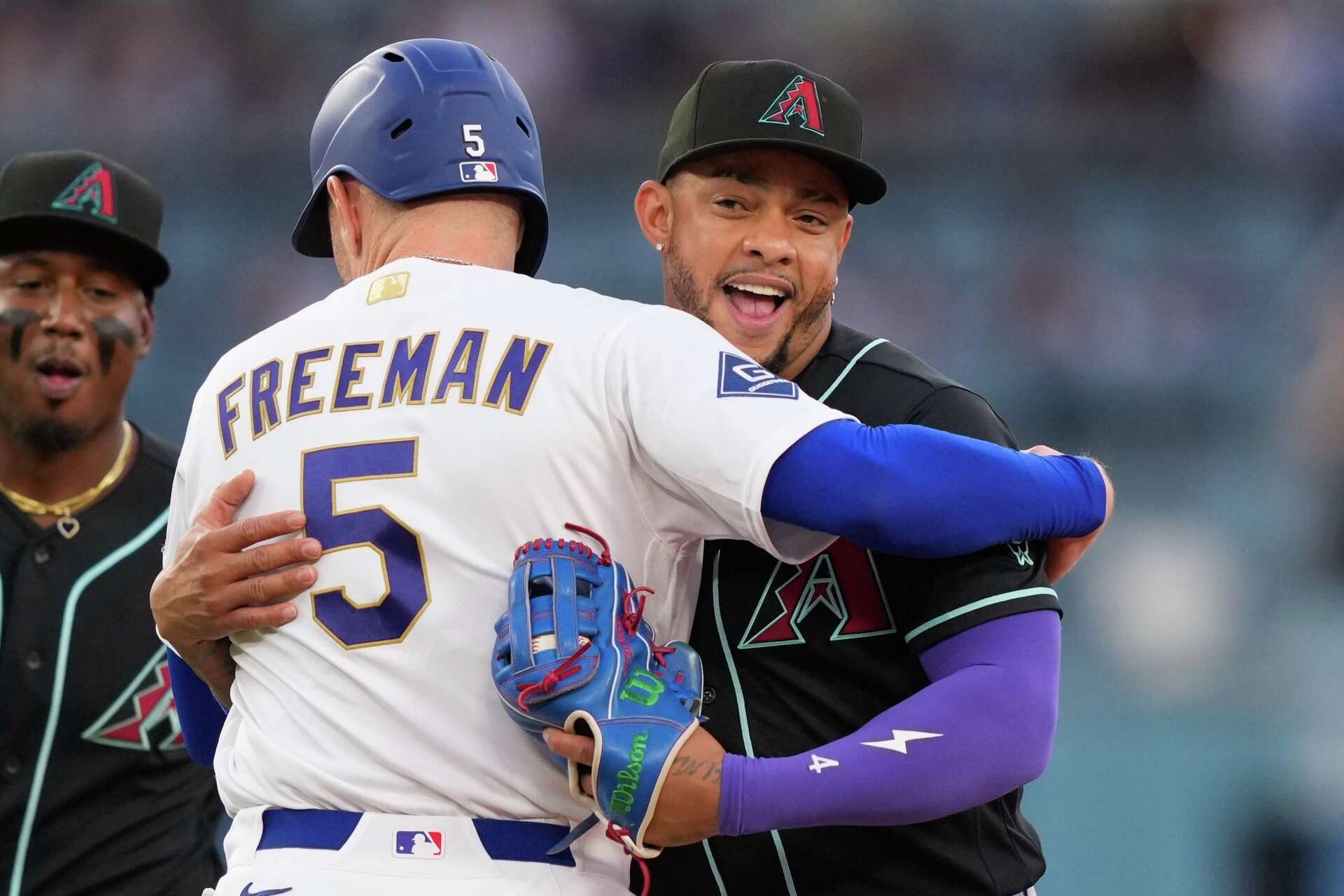 Dodgers' Freddie Freeman gets tagged out with a hug after snapping