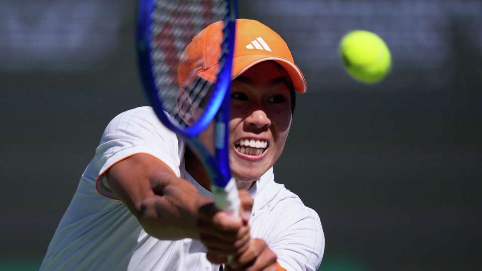 Learner Tien returns a shot against Jannik Sinner, of Italy, during a quarterfinal match at the BNP Paribas Open tennis tournament, Thursday, March 12, 2026, in Indian Wells, Calif. (AP Photo/Mark J. Terrill)