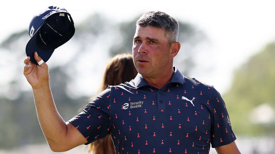Gary Woodland salutes the gallery after winning the Texas Children's Houston Open on Sunday at Memorial Park Golf Course.