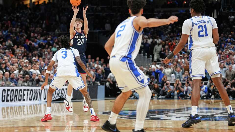 UConn guard Braylon Mullins (24) scores the winning basket during the second half against Duke in the Elite Eight of the NCAA college basketball tournament, Sunday, March 29, 2026, in Washington.