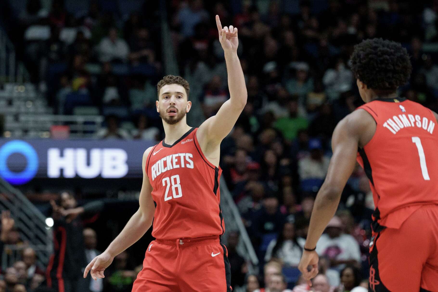 Houston Rockets center Alperen Sengun (28) reacts after a 3-point basket against the New Orleans Pelicans during the first half of an NBA basketball game in New Orleans, Sunday, March 29, 2026. (AP Photo/Matthew Hinton)