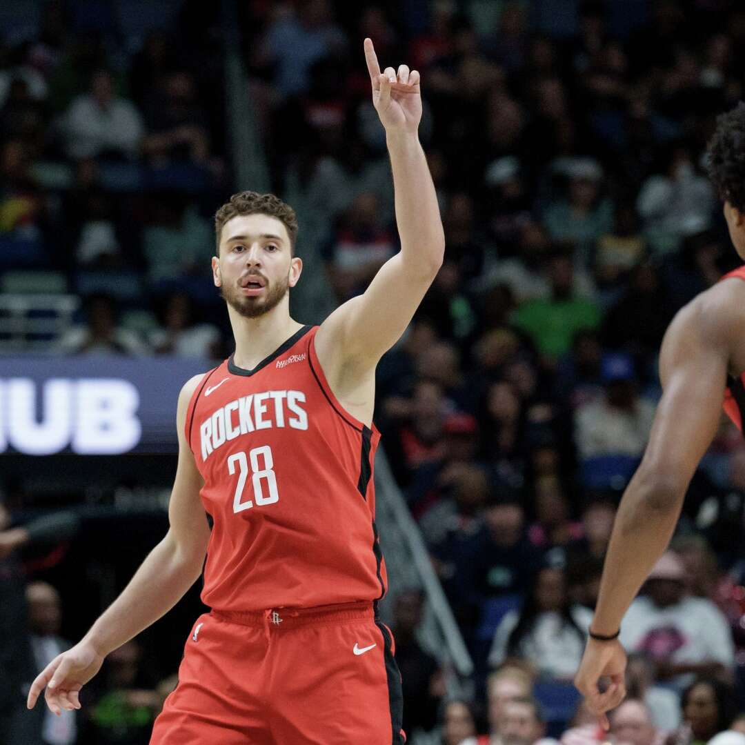 Houston Rockets center Alperen Sengun (28) reacts after a 3-point basket against the New Orleans Pelicans during the first half of an NBA basketball game in New Orleans, Sunday, March 29, 2026. (AP Photo/Matthew Hinton)