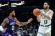 Boston Celtics forward Jayson Tatum (0) looks to shoot against Charlotte Hornets forward Miles Bridges during the second half of an NBA basketball game in Charlotte, N.C., Sunday, March 29, 2026.