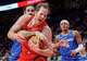 Toronto Raptors centre Jakob Poeltl (front) is fouled by Orlando Magic centre Goga Bitadze (back left) as Magic forward Paolo Banchero (right) looks on during first half NBA action in Toronto on Sunday, March 29, 2026. (Frank Gunn/The Canadian Press via AP)