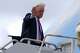 President Donald Trump waves as he boards Air Force One, Sunday, March 29, 2026, at Palm Beach International Airport in West Palm Beach, Fla.