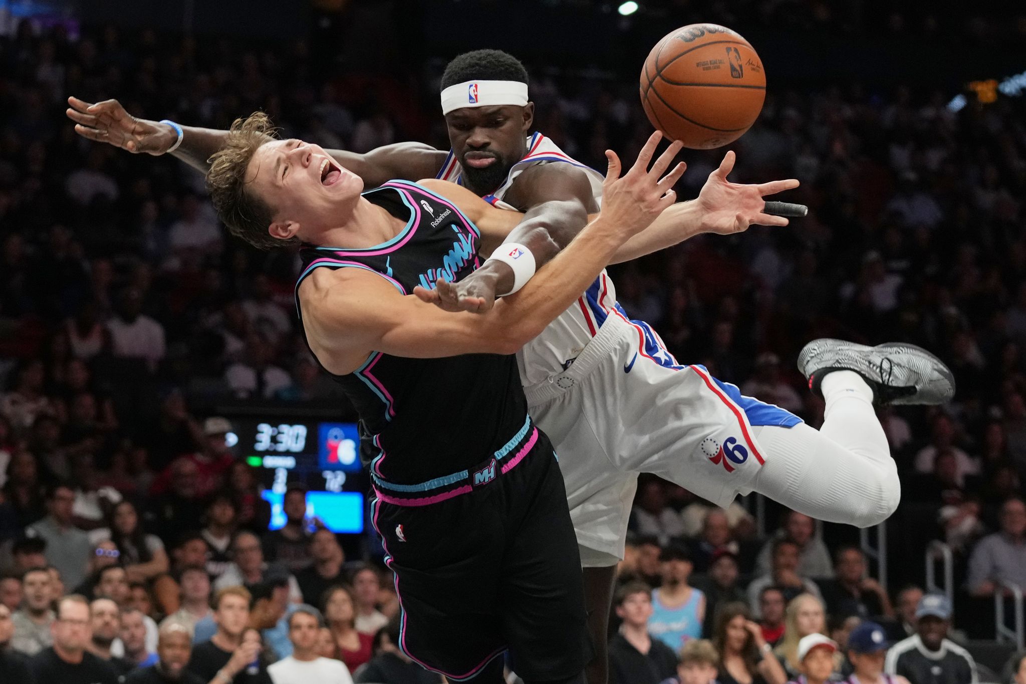 Heat rally late, pull away to beat 76ers