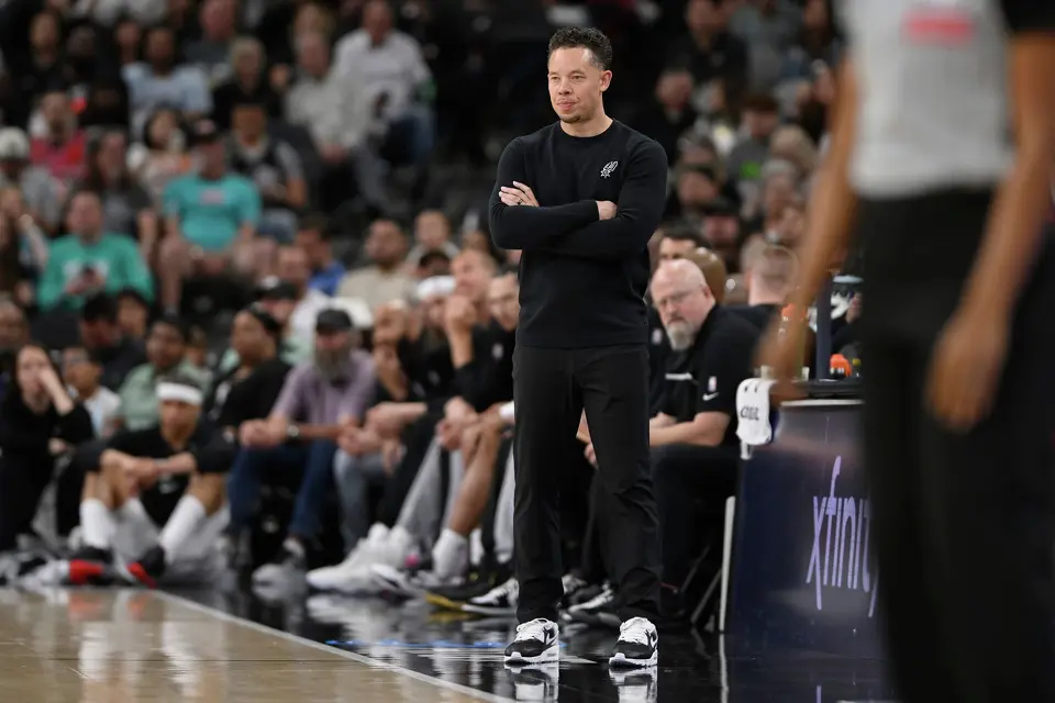 San Antonio Spurs head coach Mitch Johnson watches the play during the first half of an NBA basketball game against the Chicago Bulls, Monday, March 30, 2026, in San Antonio. (AP Photo/Darren Abate)