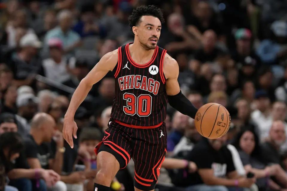 Chicago Bulls guard Tre Jones runs up court during the second half of an NBA basketball game against the San Antonio Spurs, Monday, March 30, 2026, in San Antonio. (AP Photo/Darren Abate)