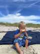 Traveler influencer Carrie-Ellen Briere's son enjoys a day at the beach in Niantic.