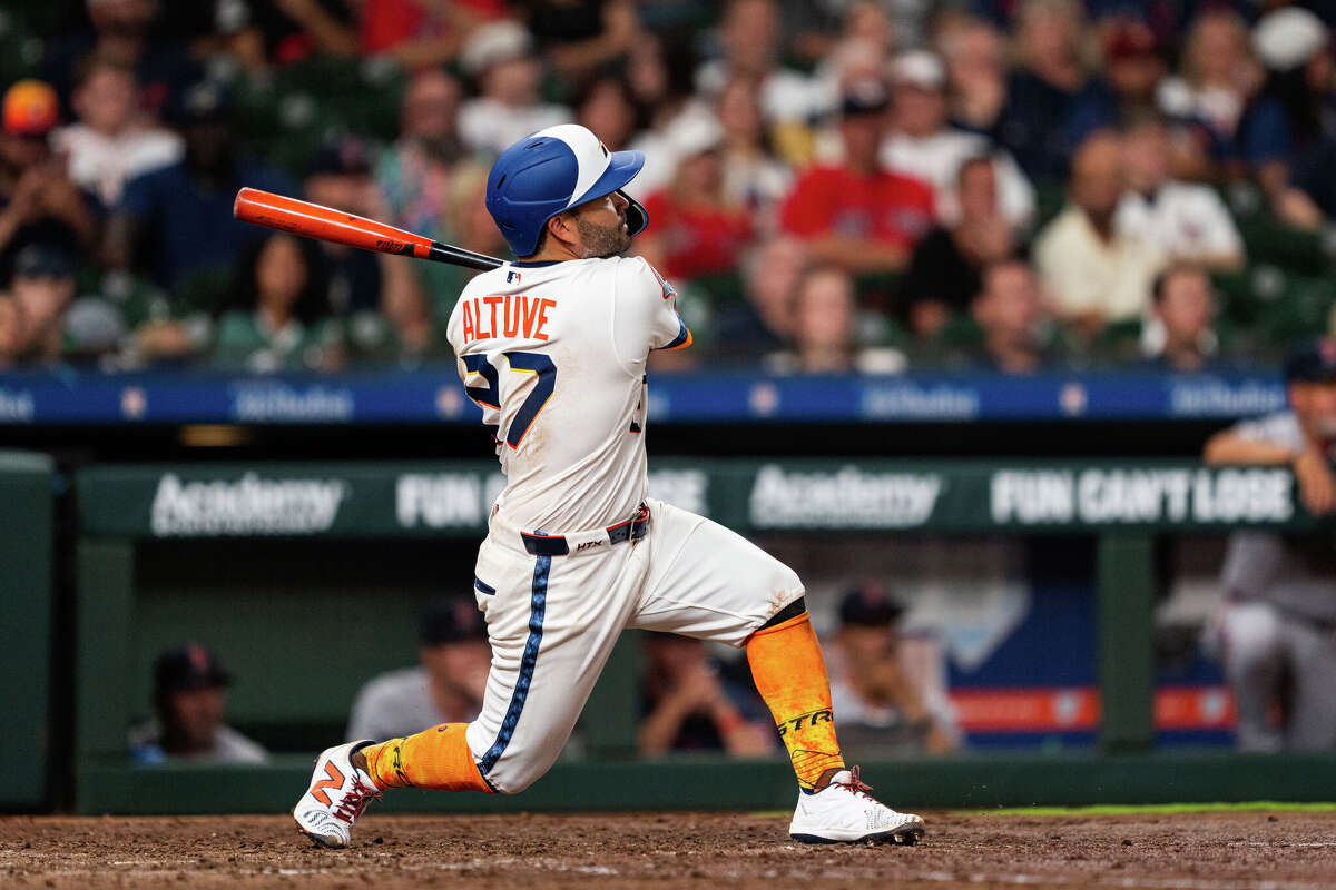 Jose Altuve #27 of the Houston Astros hits a solo home run in the eighth inning against the Boston Red Sox at Daikin Park on March 30, 2026 in Houston, Texas. 