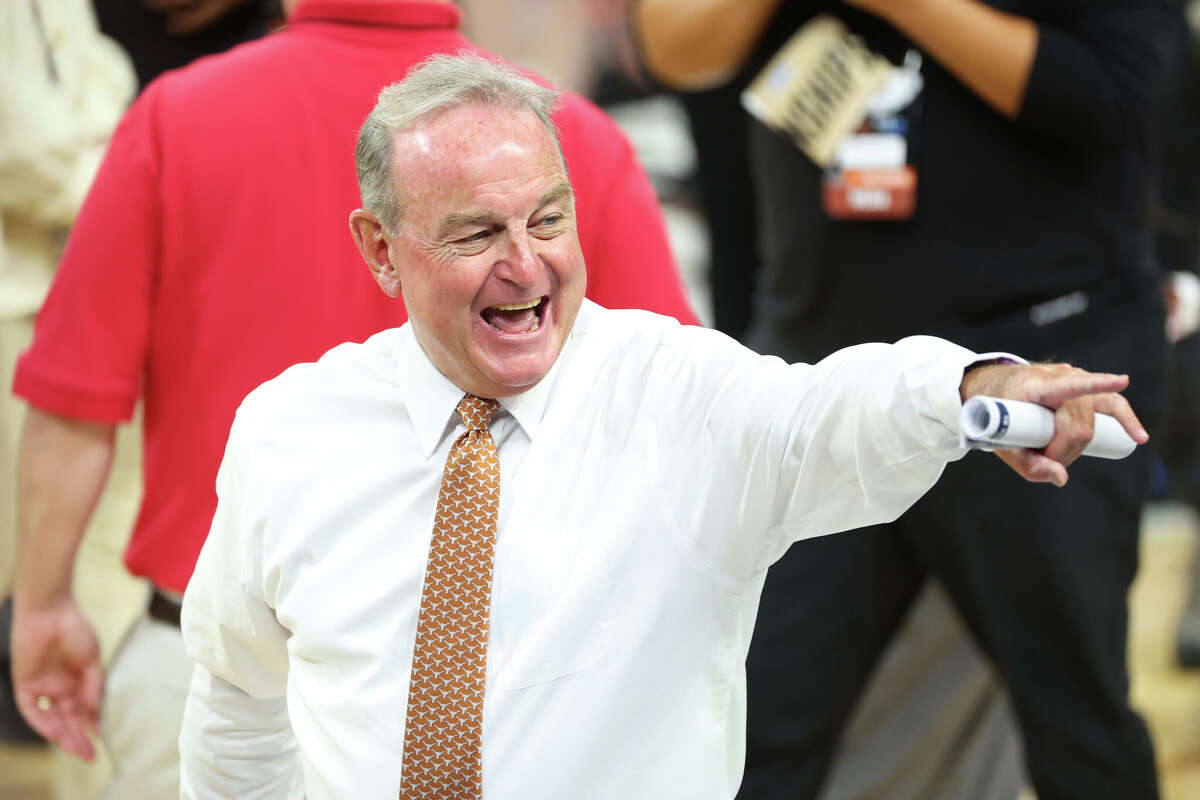 Vic Schaefer of the Texas Longhorns celebrates after defeating the Michigan Wolverines in the Elite Eight in Fort Worth, Texas.