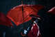 A Bishop Dunne dance team member holds an umbrella as rain falls during the playing of the national anthem before the TAPPS Division I state football championship game between Bishop Lynch and Bishop Dunne on Friday, December 7, 2018 at Midway ISD's Panther Stadium in Waco, Texas. (Ashley Landis/The Dallas Morning News)