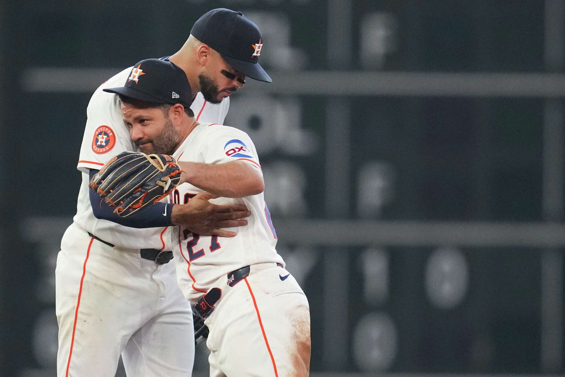 Houston Astros shortstop Carlos Correa (1) celebrates with second baseman Jose Altuve (27) after beating the Boston Red Sox 6-4 during a MLB baseball game at Daikin Park, Wednesday, April 1, 2026, in Houston.