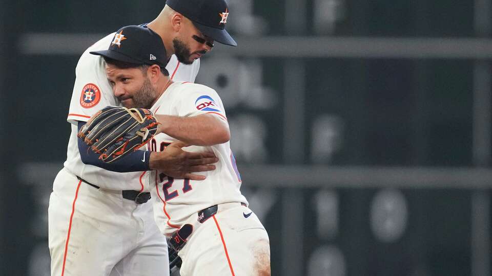Houston Astros shortstop Carlos Correa (1) celebrates with second baseman Jose Altuve (27) after beating the Boston Red Sox 6-4 during a MLB baseball game at Daikin Park, Wednesday, April 1, 2026, in Houston.