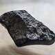 A meteorite fragment recovered in North Houston after a rare daytime fireball exploded over the area on March 21.