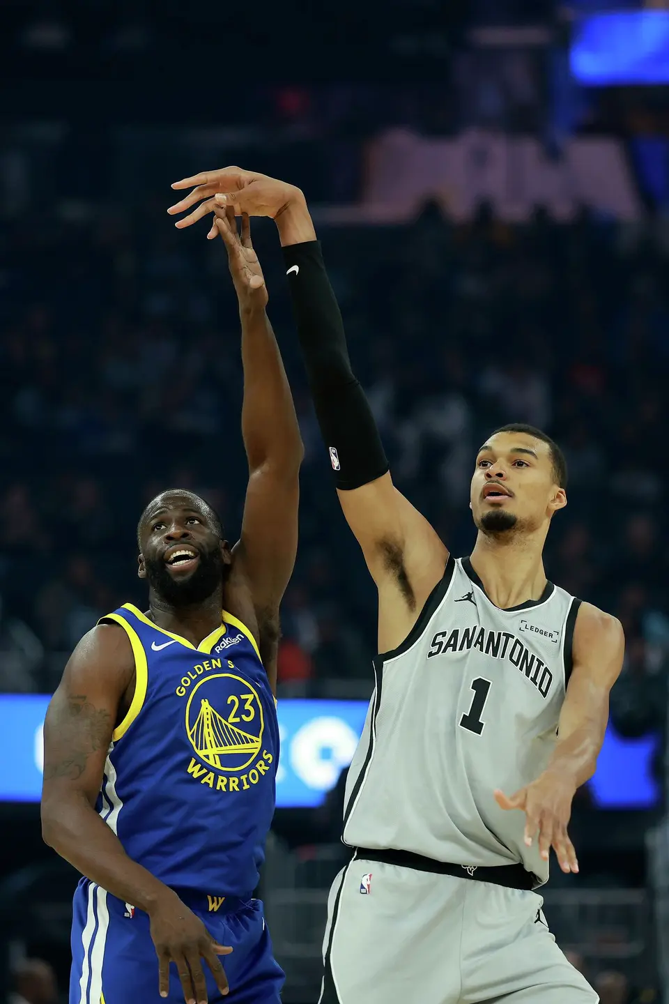 The San Antonio Spurs' Victor Wembanyama (1) puts up a shot against the Golden State Warriors' Draymond Green (23) during the first half at Chase Center on Wednesday, April 1, 2026, in San Francisco. (Ezra Shaw/Getty Images/TNS)