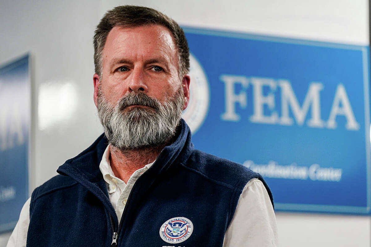 Office of Response and Recovery Director Gregg Phillips listens as U.S. Secretary of Homeland Security Kristi Noem speaks during a news conference  (Photo by Al Drago/Getty Images)