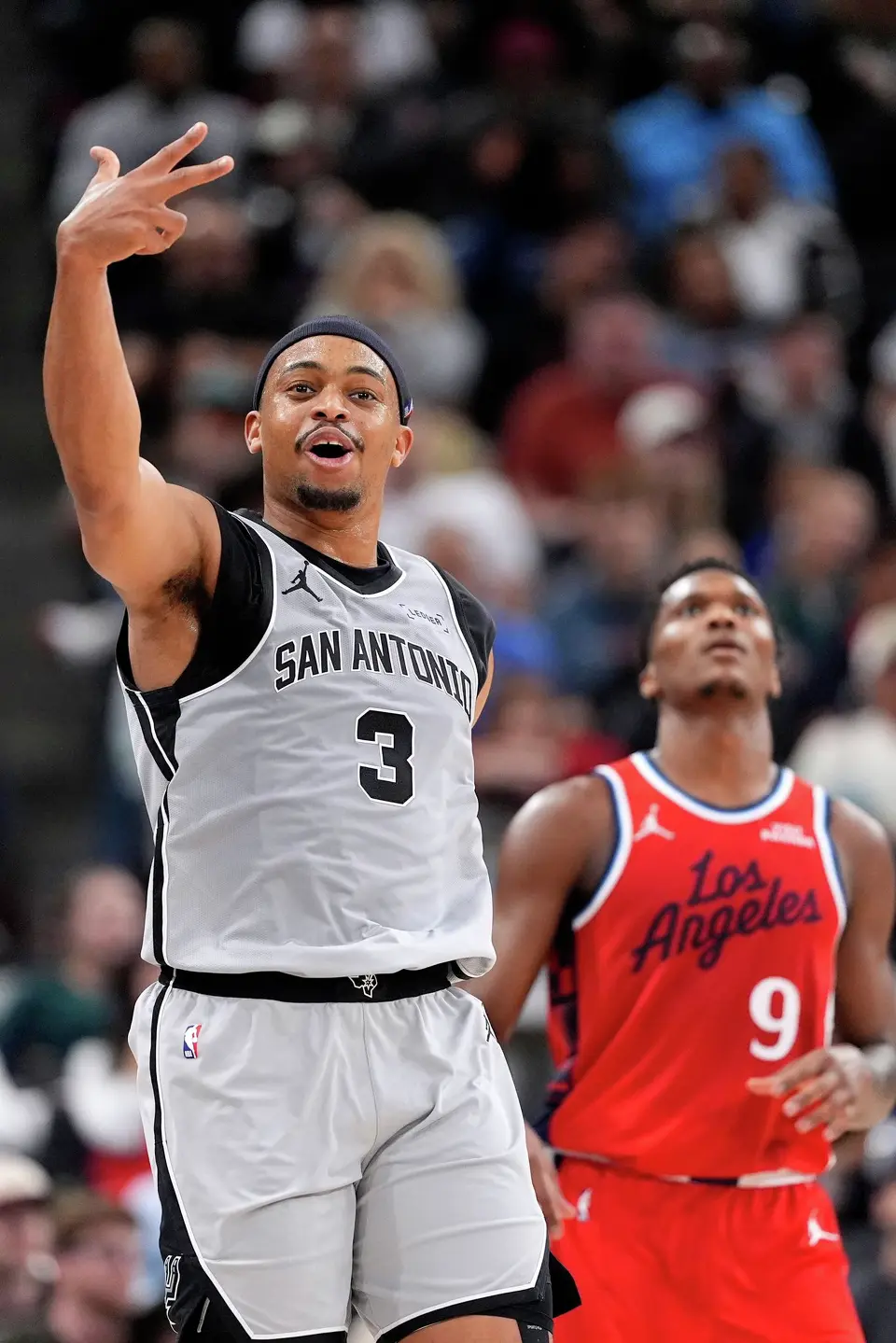 San Antonio Spurs forward Keldon Johnson, left, celebrates after scoring as Los Angeles Clippers guard Bennedict Mathurin looks on during the second half of an NBA basketball game Thursday, April 2, 2026, in Inglewood, Calif. (AP Photo/Mark J. Terrill)