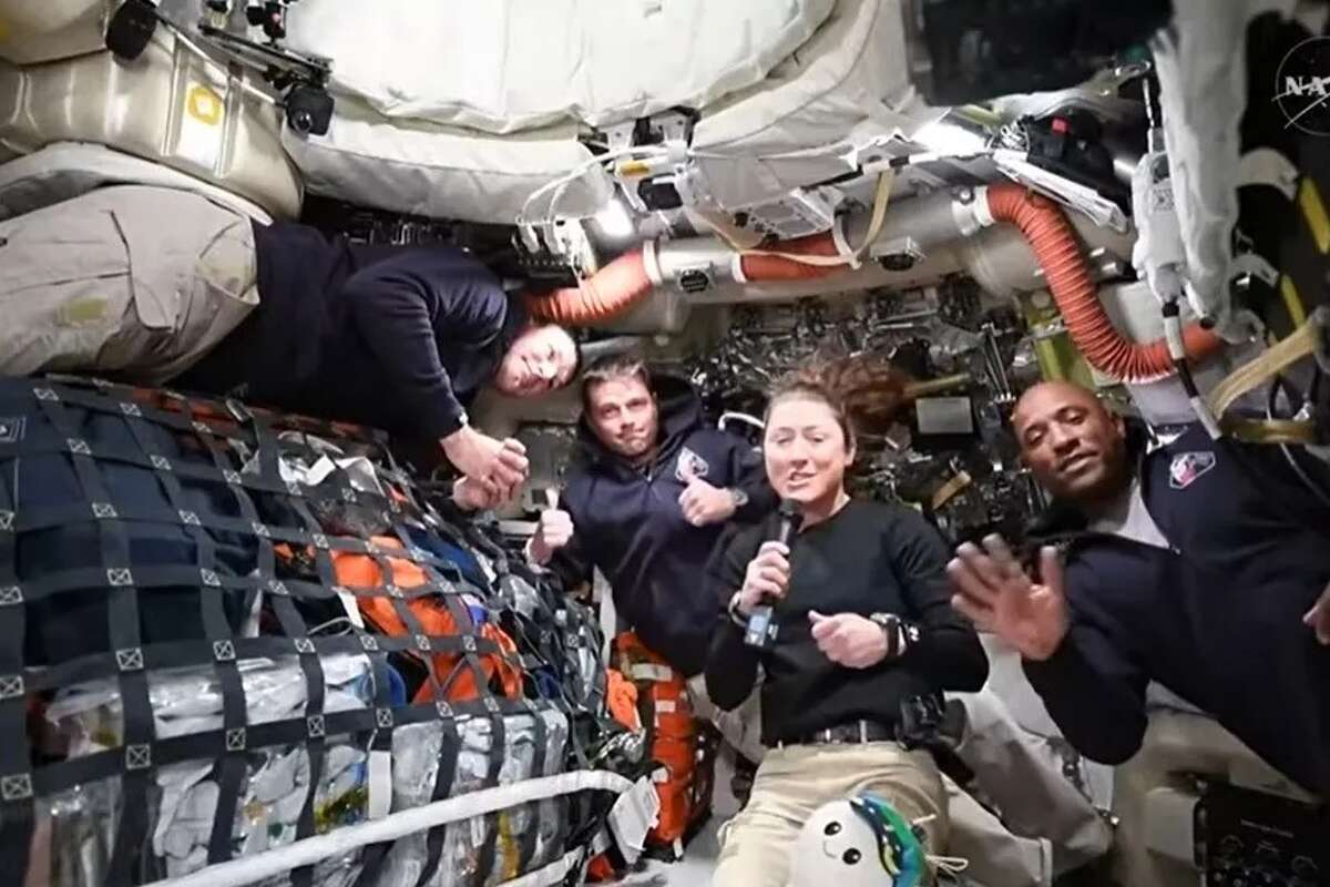 Artemis II crew members, from left, Canadian Space Agency astronaut Jeremy Hansen and NASA astronauts Reid Wiseman, Christina Hammock Koch and Victor Glover answer questions from reporters on Thursday, April 2, 2026, during the first live video of their mission.