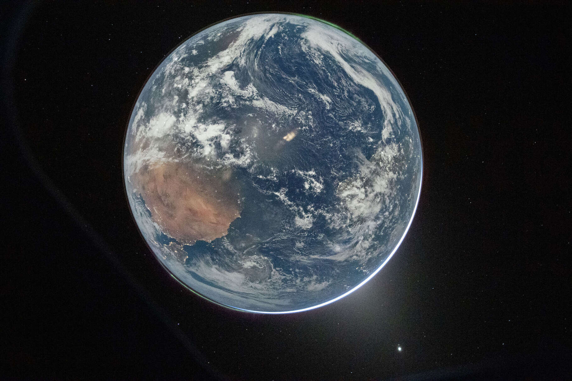 NASA astronaut and Artemis II Commander Reid Wiseman took this picture of Earth from the Orion spacecraft's window on April 2, 2026, after completing the translunar injection burn. Image Credit: NASA/Reid Wiseman
