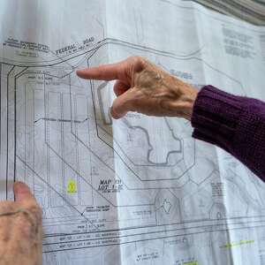 As waterfront homeowners stock up on sand, those living near sand excavation sites pay the price