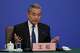 Chinese Foreign Minister Wang Yi speaks during a press conference on the sideline of the National People's Congress (NPC) at the media center, in Beijing, Sunday, March 8, 2026.
