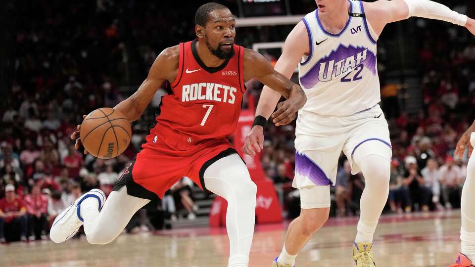 Houston Rockets forward Kevin Durant (7) controls the ball against Utah Jazz forward Kyle Filipowski (22) during the first half of an NBA basketball game, Friday, April 3, 2026, in Houston. (AP Photo/Karen Warren)