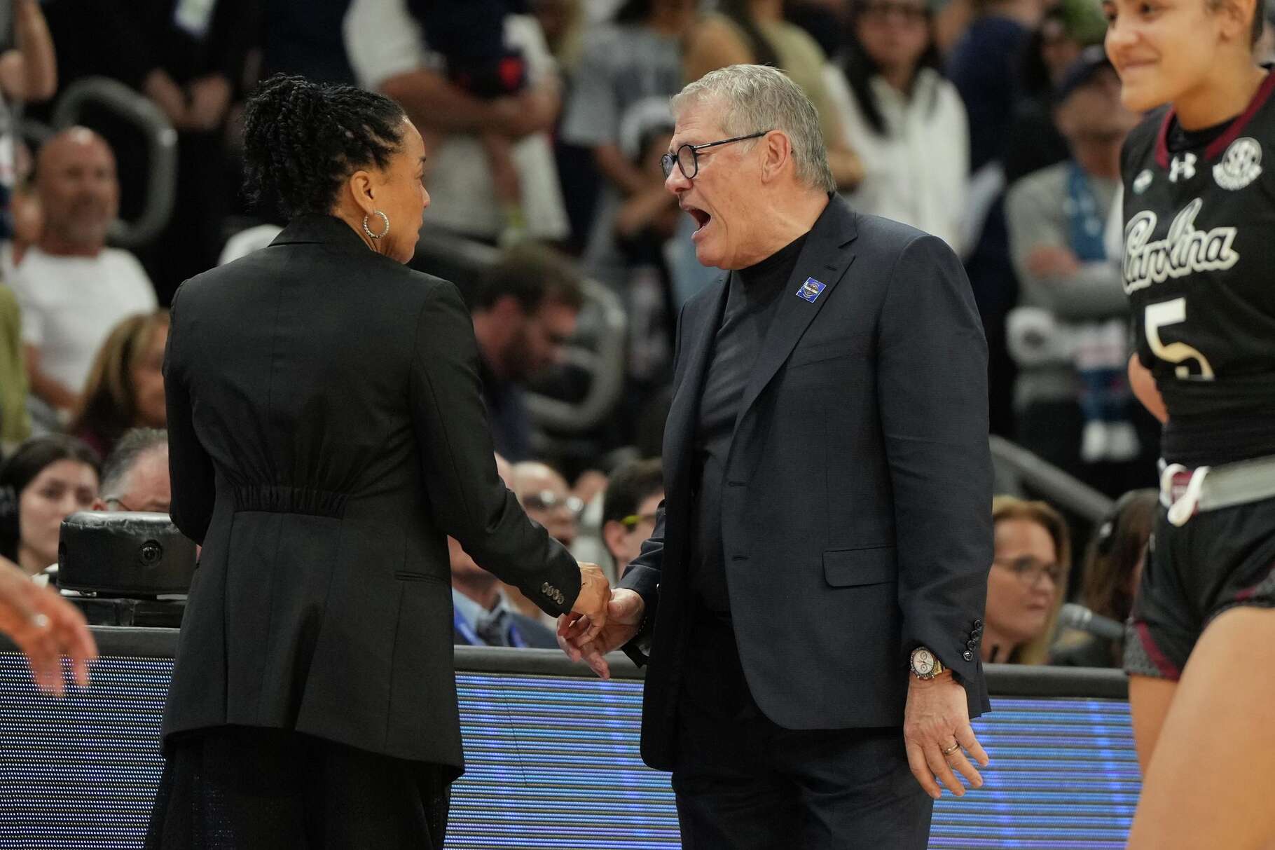 South Carolina head coach Dawn Staley, left, and UConn head coach Geno Auriemma argue after a woman's NCAA college basketball tournament semifinal game at the Final Four, Friday, April 3, 2026, in Phoenix.