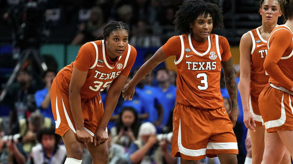 Texas Longhorns guard Rori Harmon (3) and forward Madison Booker (35) pause during a timeout in the NCAA Final Four game against UCLA at the Mortgage Matchup Center on Friday, April 3, 2026 in Phoenix.