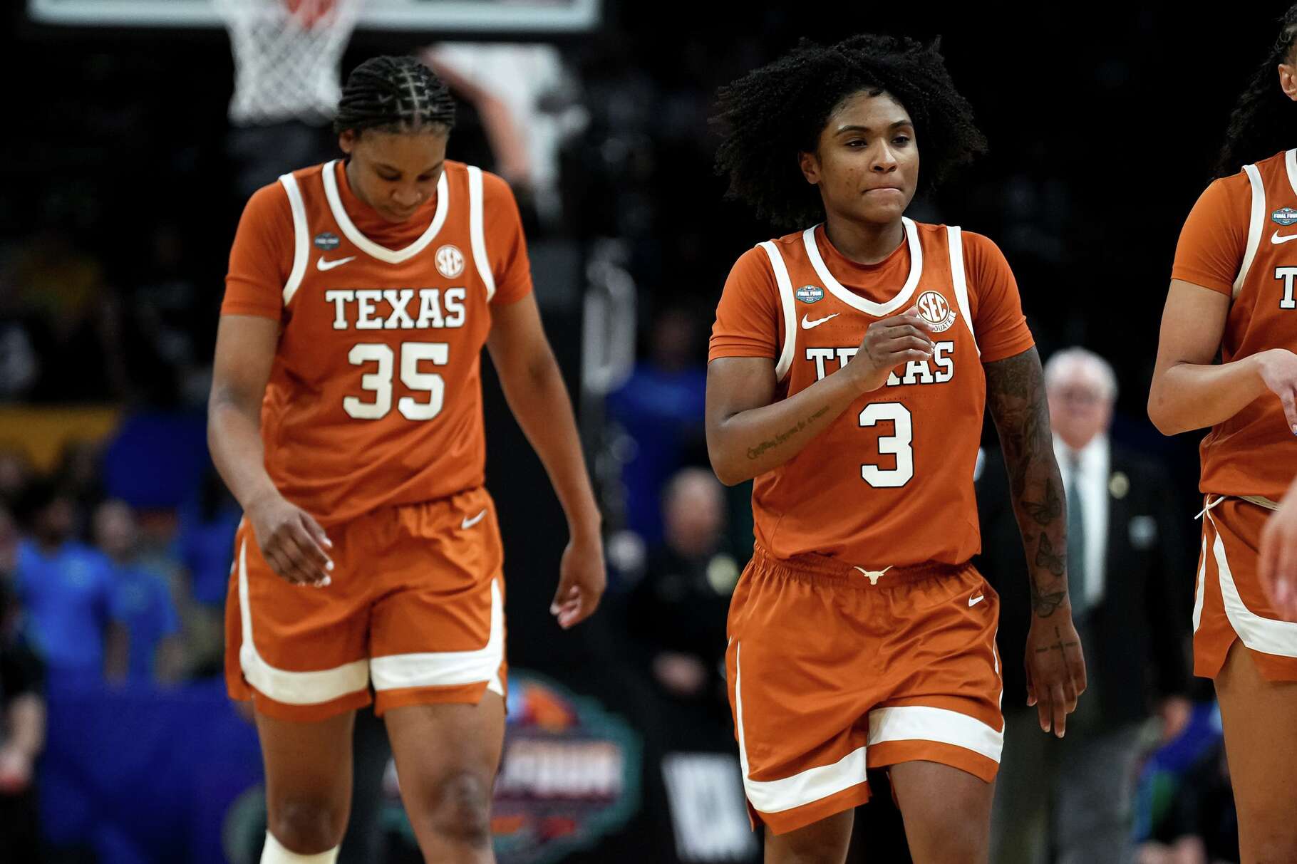 Texas Longhorns guard Rori Harmon (3) and forward Madison Booker (35) leave the court during a timeout in the NCAA Final Four game against UCLA at the Mortgage Matchup Center on Friday, April 3, 2026 in Phoenix, Arizona.