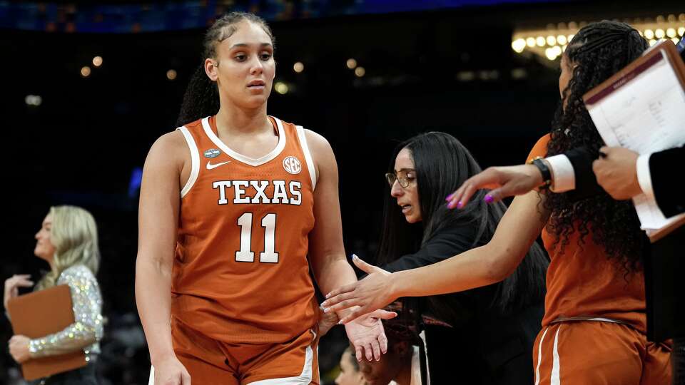 Texas Longhorns forward Justice Carlton (11) leaves the NCAA Final Four game against UCLA at the Mortgage Matchup Center on Friday, April 3, 2026 in Phoenix, Arizona.