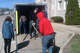 Craig Boyd of Boyd Music and members of the Jacksonville High School football team prepare to unload pianos at The Esprit de Corps Academy in the former Grace United Methodist Church building.