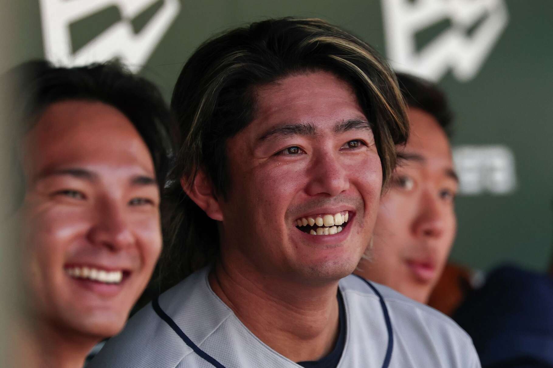 Houston Astros pitcher Tatsuya Imai, center, smiles in the dugout during the third inning of a baseball game against the Athletics, Saturday, April 4, 2026, in West Sacramento, Calif. (AP Photo/Sara Nevis)