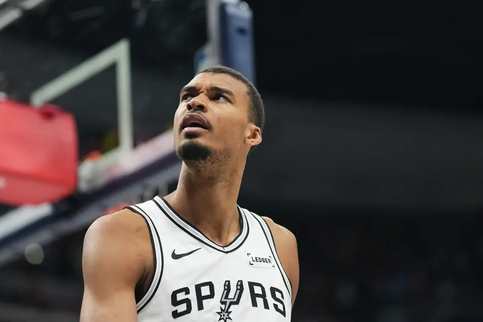 San Antonio Spurs center Victor Wembanyama reacts after being called for a foul late in the second half of an NBA basketball game against the Denver Nuggets, Saturday, April 4, 2026, in Denver. (AP Photo/David Zalubowski)