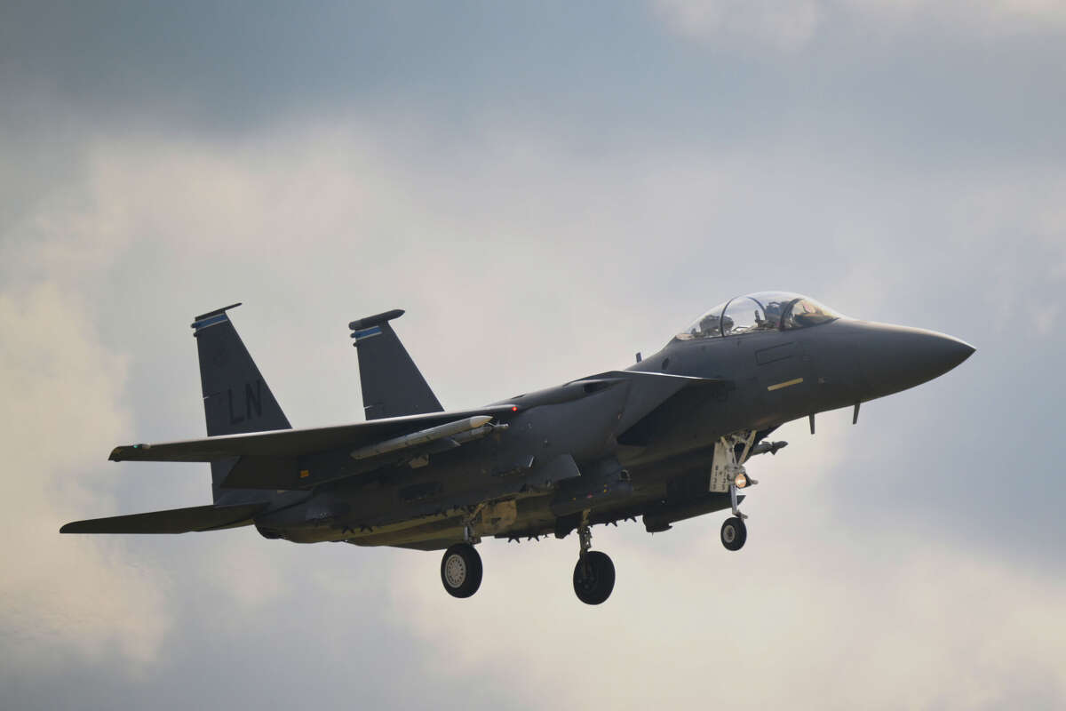 A USAF McDonnell Douglas F-15E Strike Eagle lands at RAF Lakenheath on July 22, 2025 in Lakenheath, United Kingdom. Texas Gov. Greg Abbott is receiving backlash after sharing an AI-generated image related to the rescue of crew members in a F-15E fighter jet downed over Iran this weekend.