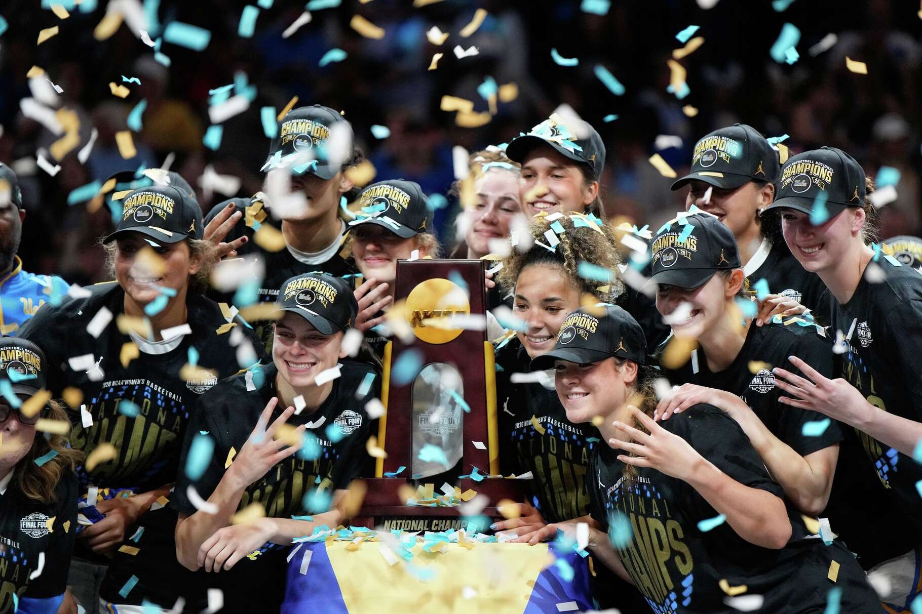 UCLA players celebrate after defeating South Carolina in the women's National Championship Final Four NCAA college basketball tournament game, Sunday, April 5, 2026, in Phoenix.