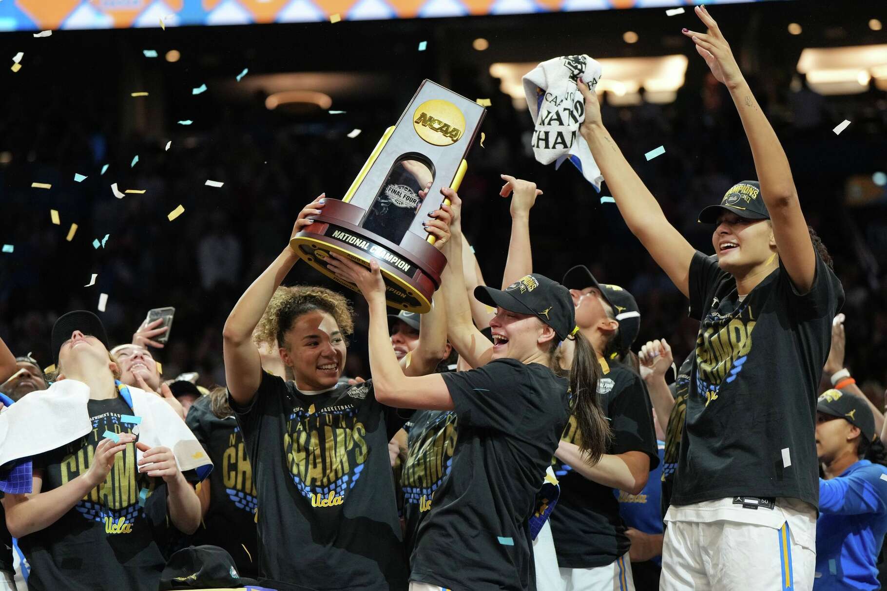 UCLA players celebrate after defeating South Carolina in the women's National Championship Final Four NCAA college basketball tournament game, Sunday, April 5, 2026, in Phoenix.