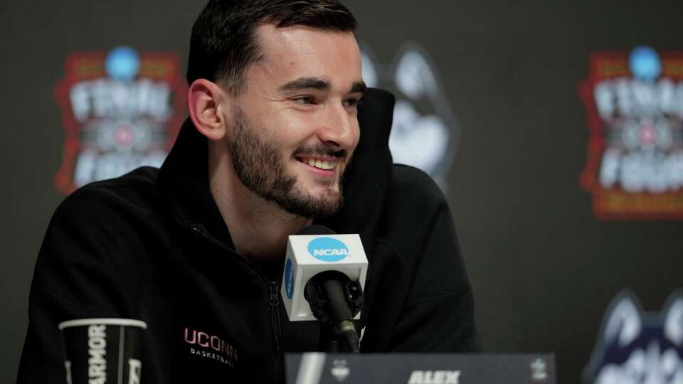 UConn forward Alex Karaban speaks during a news conference ahead of a national championship NCAA college basketball tournament game against Michigan at the Final Four, Sunday, April 5, 2026, in Indianapolis.