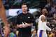 Los Angeles Lakers head coach JJ Redick walks onto the court during a time out in the first half of an NBA basketball game against the Dallas Mavericks in Dallas, Sunday, April 5, 2026.